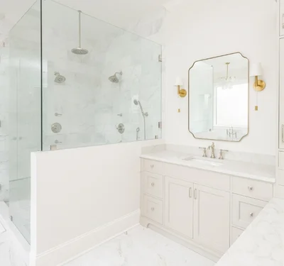 View showing walk-in shower and sink after bathroom remodel by Tru2Word Contracting